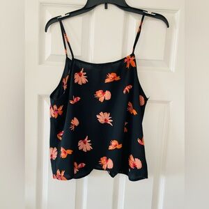 Large Tank Black and orange brand is Lush